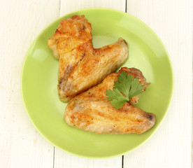roasted chicken wings with parsley in the plate