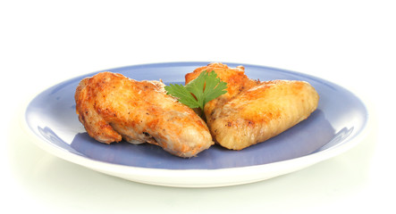 roasted chicken wings with parsley in the plate isolated