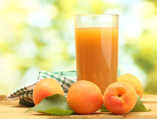 glass of apricot juice and fresh apricots
