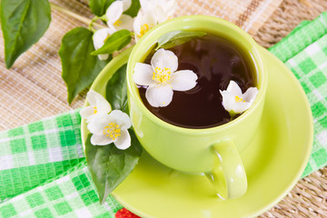 green tea and sprigs of jasmin