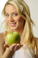 Sexy blond girl with apple