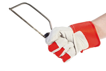 Hand with protection glove holding Hacksaw