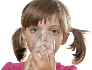 little girl using inhaler - respiratory problems