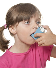 girl using inhaler - respiratory problems