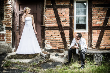 Young couple in front of the old house in the countryside © shaiith