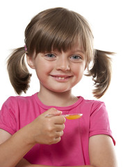 little girl take a cough syrup on a spoon
