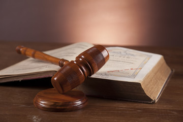 Law and justice stuff on wood table and dark background 
