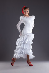 Fototapeta premium Young woman dance in white flamenco costume