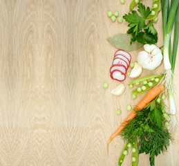 Fototapeta na wymiar Background with fresh vegetables on wooden texture