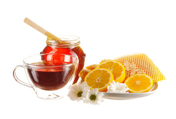 Jar of honey and tea cup