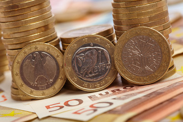 Euro coins on banknote money background