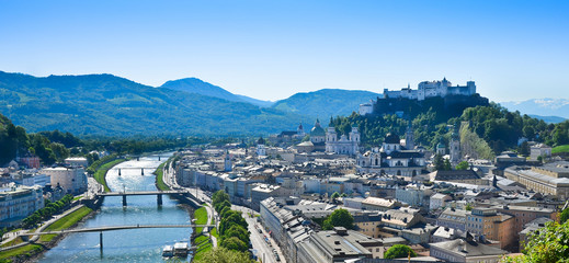 Panorama of Salzburg in Austria, Europe. Festival city where Wolfgang Amadeus Mozart was born. View of the castle, Moenchsberg, old town and the Salzach river. - obrazy, fototapety, plakaty