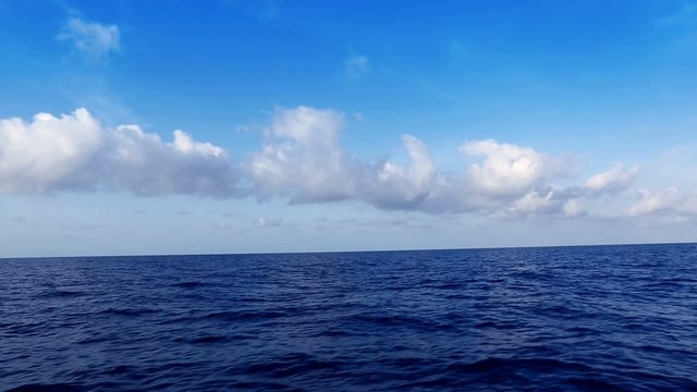 saling in deep wavy blue mediterranean sea