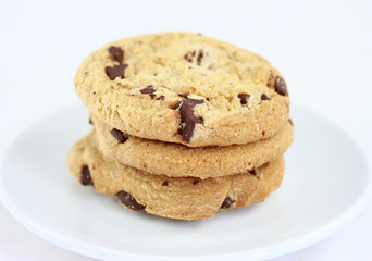 Chocolate chip cookies group on a saucer isolated on white