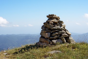 Hiking cairn marking a trail in mountain