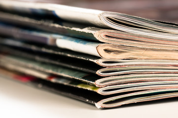 A large stack of magazines piled high.