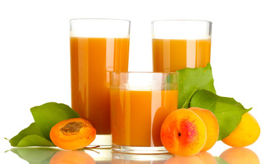 three glasses of apricot juice and apricots with leaf isolated