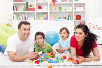 Kids with their parents playing