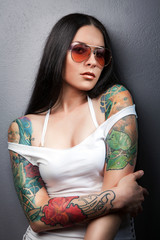 Beautiful sexy glamorous girl with tattoos.