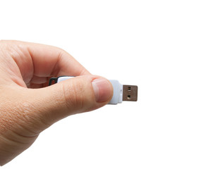 USB flash drive in hand on white background