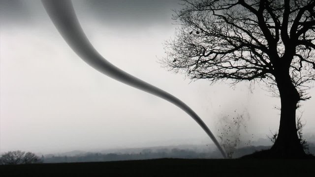 Funnel tornado whips up debris