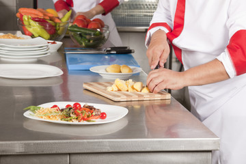 Two chefs at work in a restaurant