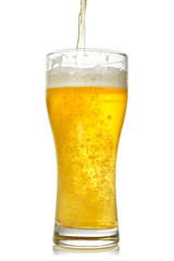 Cold beer pouring into glass