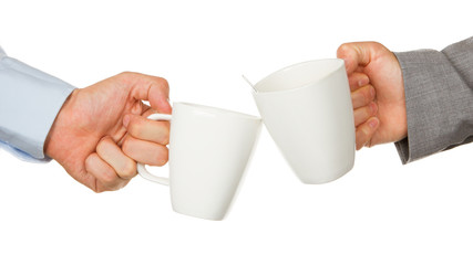 Business partners hands holding cups of coffee