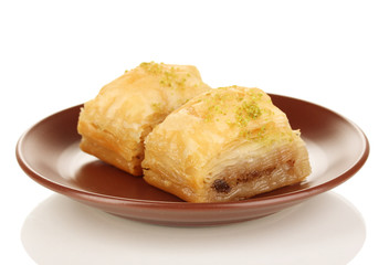 Sweet baklava on plate isolated on white
