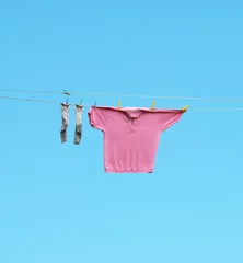 Fototapeten Socks and shirt hang out to dry © vali_111