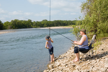 Grandfather and grandson go fishing