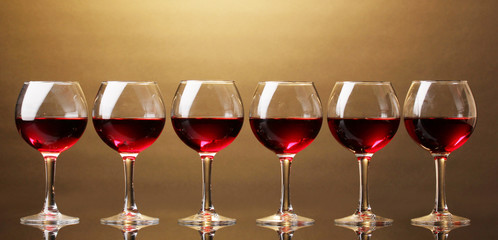 Wineglasses on brown background