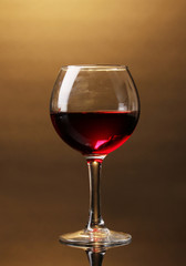 Wineglass on brown background