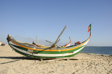 Fototapeta na wymiar Typical portuguese fishing boat on the beach, Espinho, Portugal