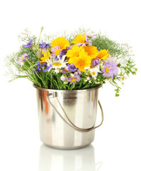 beautiful bouquet of bright  wildflowers in bucket, isolated