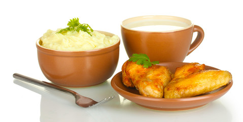 Mashed potato with parsley in the bowl and roasted chicken