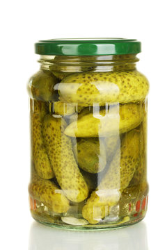 Jar of canned cucumbers isolated on white