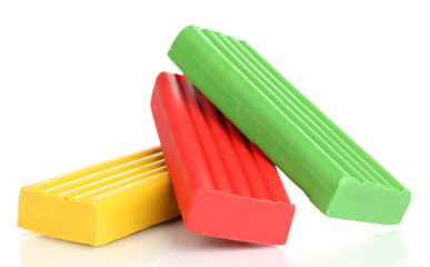 Children bright plasticine isolated on white