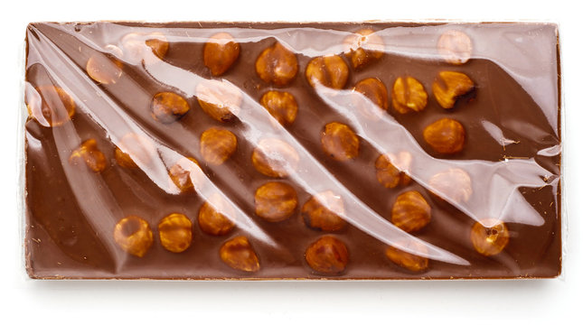 Chocolate with nuts wrapped in transparent foil.