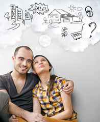 Closeup portrait of adult couple sitting on floor at their apart