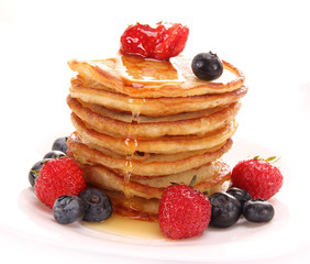 Small pancakes topped with honey 