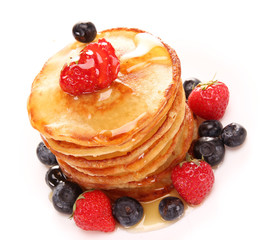 Small pancakes topped with honey 