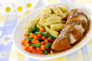 Chicken breast with potato dumplings and vegetables