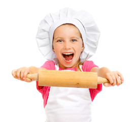 beautiful little girl with a rolling pin