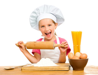 beautiful little girl with spaghetti, flour and eggs