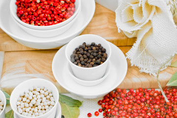 Black, white and red peppercorns