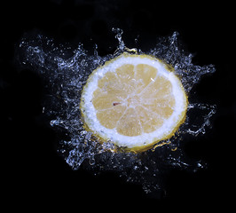 lemon water splash in a black background