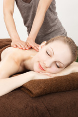 Fototapeta na wymiar Massage a young woman