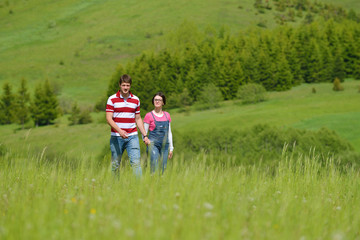Fototapeta premium Portrait of romantic young couple smiling together outdoor