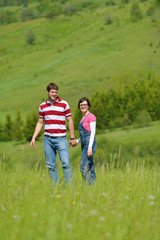 Fototapeta premium Portrait of romantic young couple smiling together outdoor